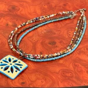 Artisan Multicolor Beaded Necklace with Blue Pendant
